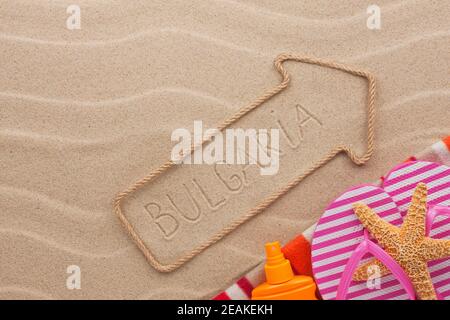 Bulgaria  pointer and beach accessories lying on the sand Stock Photo