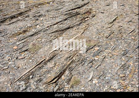 Abstract detail of parallel layered rocks and gravel. Stock Photo