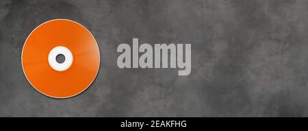 Orange CD - DVD mockup template isolated on concrete background banner Stock Photo