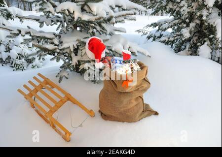 Christmas presents on a sledge in the snow Stock Photo