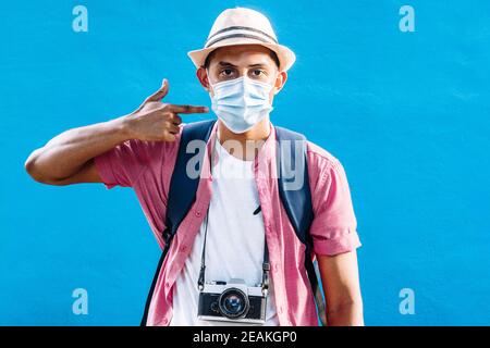 adult man pointing with his hand the mask. Stock Photo