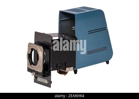 Vintage projector. Close-up of a old blue gray projector for viewing slides and filmstripes isolated on a white background. The projector is open for maintenance and cleaning.Macro. Stock Photo