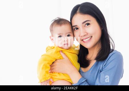 mother holding his newborn little baby in her arms Stock Photo