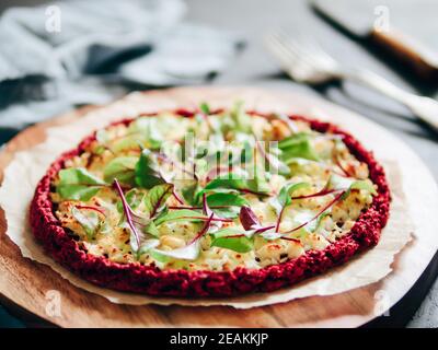 beetroot pizza crust with fresh mangold leaves Stock Photo