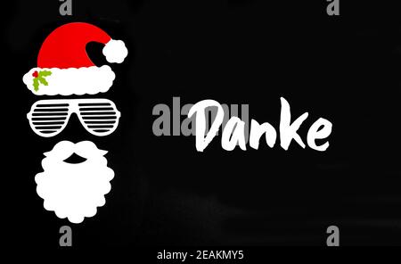 Santa Claus Paper Mask, Black Background, Danke Means Thank You Stock Photo