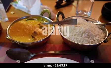 Chicken tika masala with white rice in One Step Up restaurant in Kolkata, West Bengal, India Stock Photo