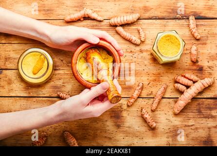 Turmeric powder and fresh turmeric Stock Photo