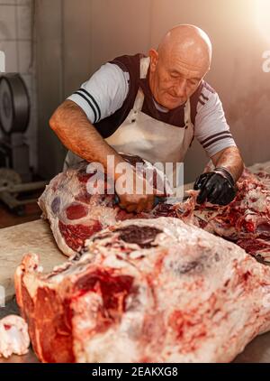 Butcher working in factory Stock Photo