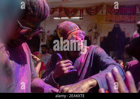 Jodhpur, rajastha, india - March 20, 2020: Group of Young indian men dancing celebrating holi festival, closeup of face covered with colored powder. Stock Photo