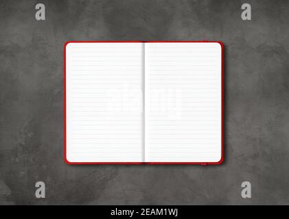 Red open lined notebook isolated on dark concrete background Stock Photo
