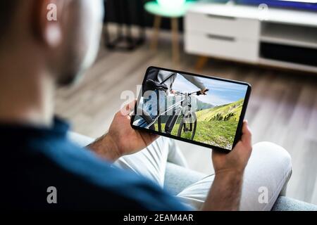 Man Watching TV Film Or Video Stock Photo