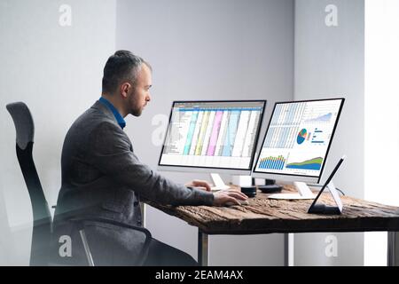 Analyst Employee Working With Spreadsheet Stock Photo