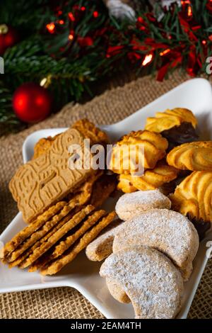 Different types of biscuits with rustic Christmas decorations Stock Photo