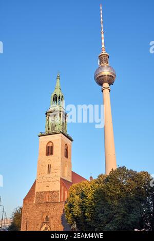 The famous Television Tower and the Marienkirche at the Alexanderplatz in Berlin Stock Photo