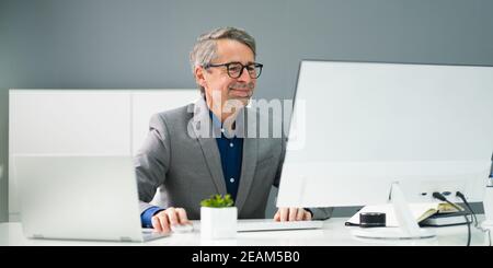 Happy Professional Man Employee Using Computer Stock Photo