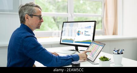 Analyst Employee Using Spreadsheet Software Stock Photo