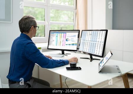 Analyst Employee Using Spreadsheet Software Stock Photo