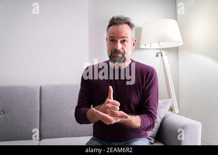 Senior Learning Sign Language Stock Photo