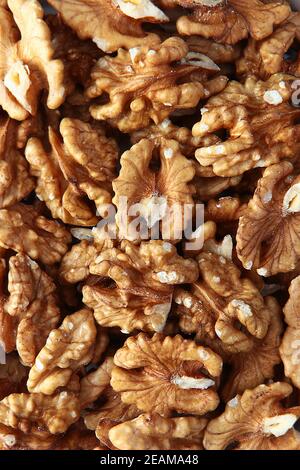 Walnut without shell in large quantities. Peeled walnut. Natural product. View from above. Copy space. Full frame. Stock Photo