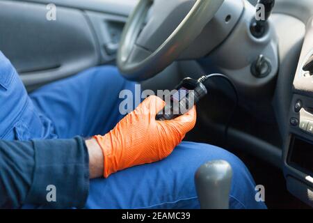 Using a scan tool for auto repair diagnostics and check engine Stock Photo