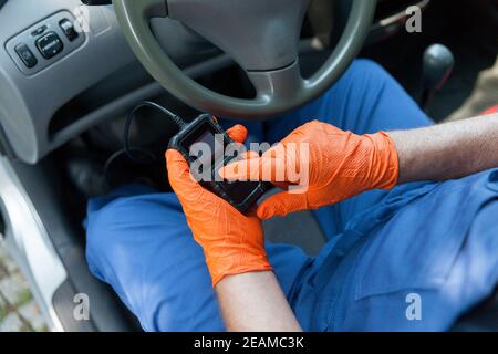 Using a scan tool for auto repair diagnostics and check engine Stock Photo
