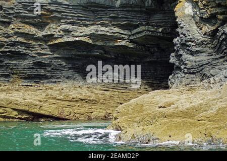 View of the rocky coast near Carrigaholt from the sea Stock Photo