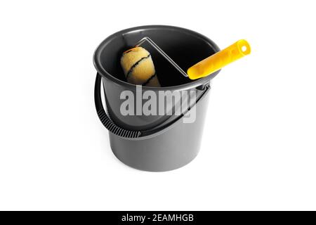 Paint roller in a bucket. Stock Photo