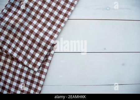 Wooden table covered with tablecloth cloth checkered Stock Photo