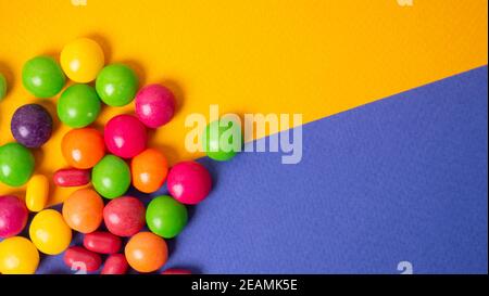 colorful little candies on a colored background Stock Photo