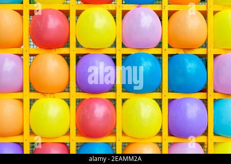 Inflatable balls in square shelves Stock Photo