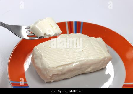 soft cheese stracchino spread on bread soft cheese stracchino spread on bread Stock Photo