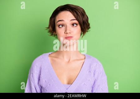 Photo of carefree playful person squint eyes holding breath wear violet isolated on green color background Stock Photo