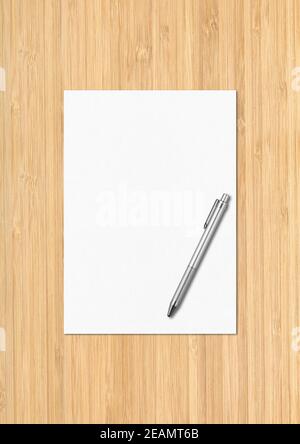 Blank White A4 paper sheet and pen mockup template on wooden background Stock Photo