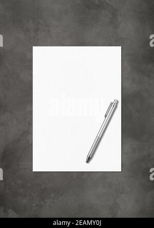 Blank White A4 paper sheet and pen mockup template on dark concrete background Stock Photo