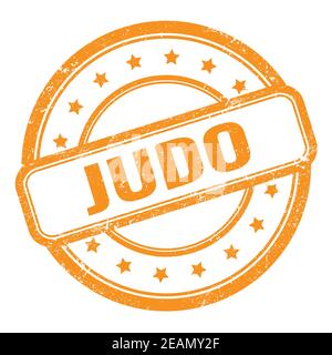 JUDO text on orange grungy vintage round rubber stamp. Stock Photo