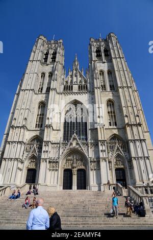 BRUSSELS, BELGIUM - May 05, 2014: Looking upwards, towards the front elevation of Brussels Cathedral, in Brussels, Belgium, with people walking and si Stock Photo