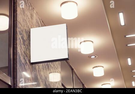 Blank hanging wall sign to add company identity logo Stock Photo