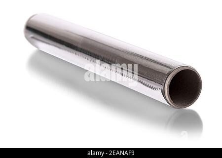 A Silver aluminium foil roll isolated on the white background. The foil is extremely pliable and can be bent or wrapped around objects with ease. Stock Photo