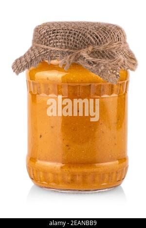 glass jar with squash caviar on white background Stock Photo