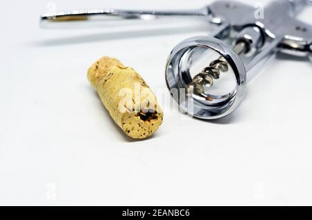steel wing corkscrew with a perforated cork Stock Photo