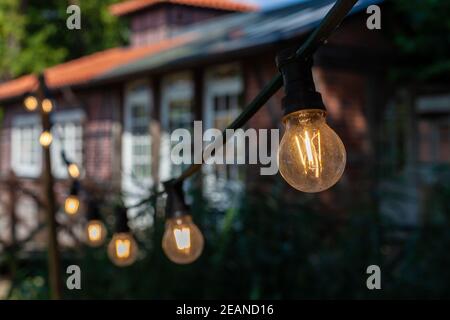 light decoration from light bulbs at country celebrations, wedding Stock Photo