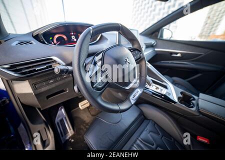MOSCOW, RUSSIA - MARCH 15, 2020: steering wheel and driver's seat in the interior of the new SUV Peugeot 3008. Stock Photo