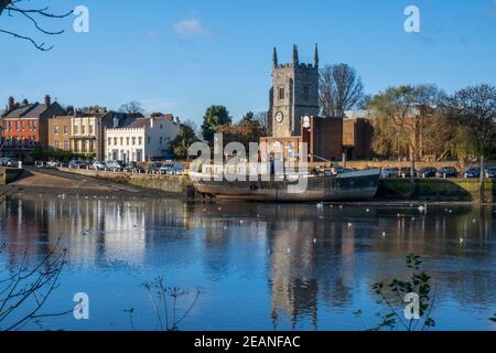 All Saints Church, Isleworth town centre, seen from the Thames Path in Kew in autumn, River Thames, London, England, United Kingdom, Europe