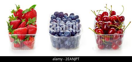 Blueberry, cherry and strawberry in plastic transparent container box, isolated on white background Stock Photo