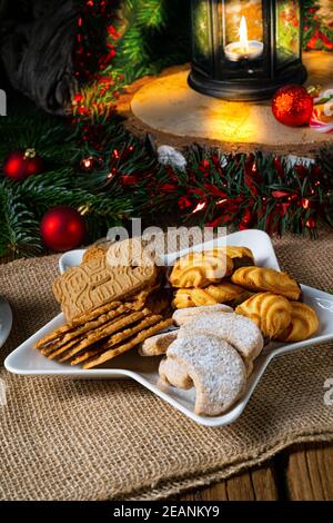 Different types of biscuits with rustic Christmas decorations Stock Photo