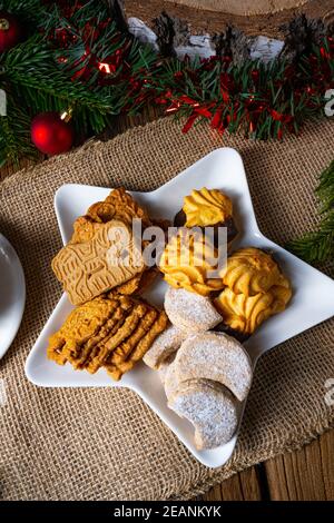 Different types of biscuits with rustic Christmas decorations Stock Photo