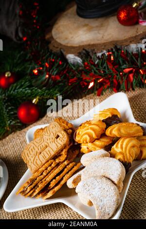 Different types of biscuits with rustic Christmas decorations Stock Photo