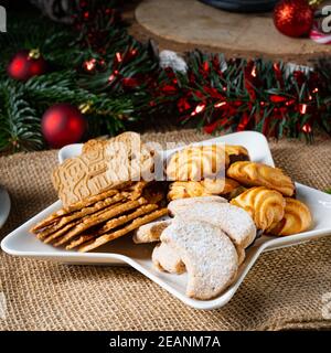 Different types of biscuits with rustic Christmas decorations Stock Photo