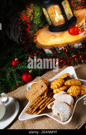 Different types of biscuits with rustic Christmas decorations Stock Photo