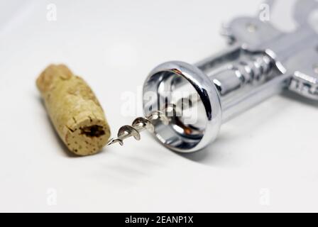 steel wing corkscrew with a perforated cork Stock Photo